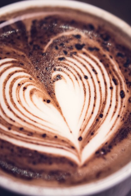 Hot chocolate drink with heart shape latte art