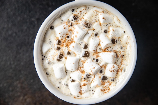 Hot chocolate marshmallow cocoa or coffee hot drink warming meal snack on the table