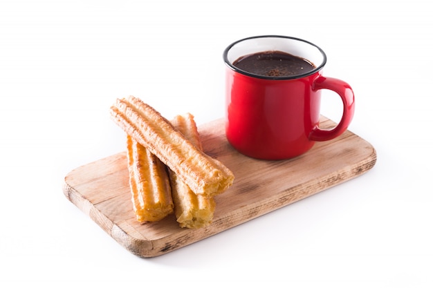Hot chocolate with churros isolated on white