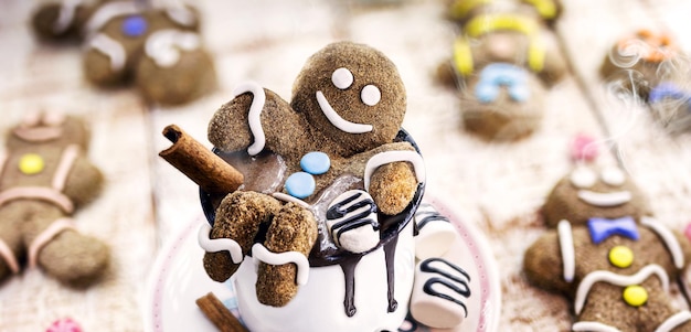 Hot chocolate with gingerbread man cookie and warm winter drink fun food photo