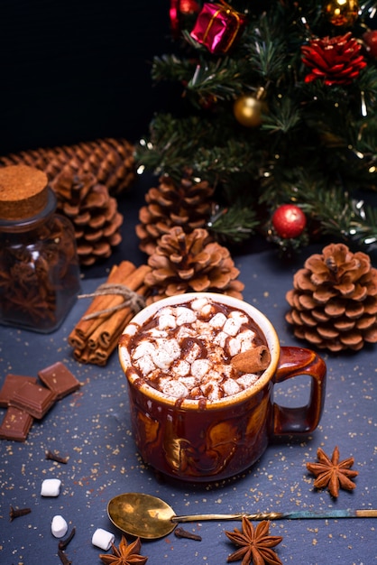 Hot chocolate with marshmallow slices in a brown ceramic mug 