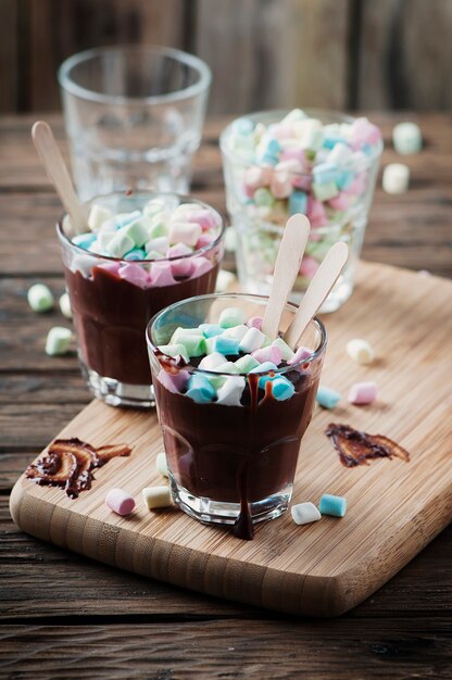 Hot chocolate with marshmallow on the wooden table