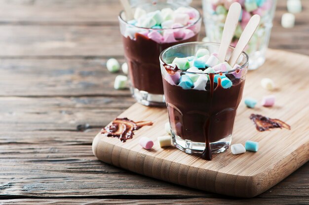 Hot chocolate with marshmallow on the wooden table