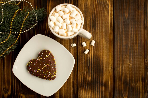 Hot chocolate with marshmallows and Christmas cookie