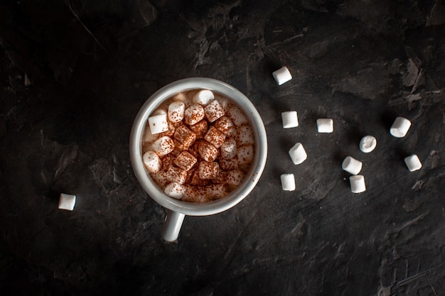 Hot chocolate with marshmallows and cocoa powder