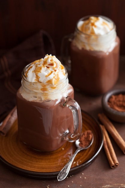 Hot chocolate with whipped cream caramel in mason jar