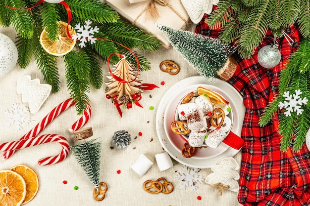 Hot cocoa or chocolate with marshmallows. Christmas traditional decor, New Year festive arrangement. The concept of coziness and good mood, top view