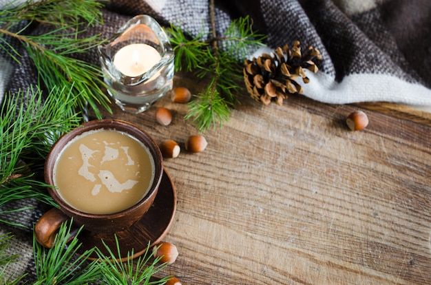 Hot cocoa, warm pleid and candle. Rustic life.