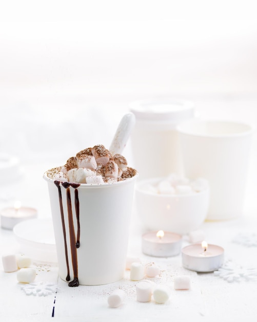 Hot cocoa with marshmallow in a white mug