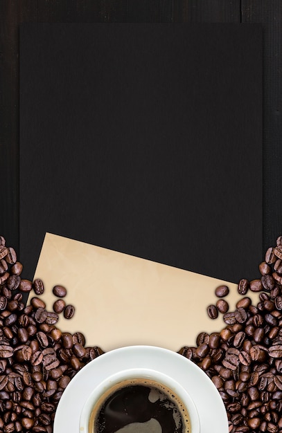 Hot coffee and bean on wooden background. top view