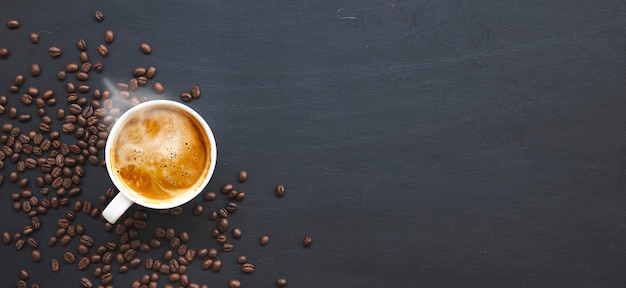 Hot coffee and bean on wooden table