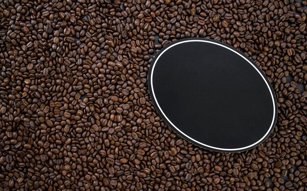 hot coffee and beans on wooden table background