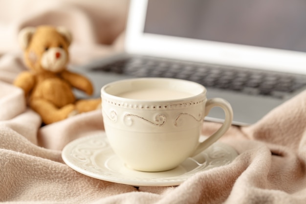 Hot coffee and book on wool background. seasonal relax concept