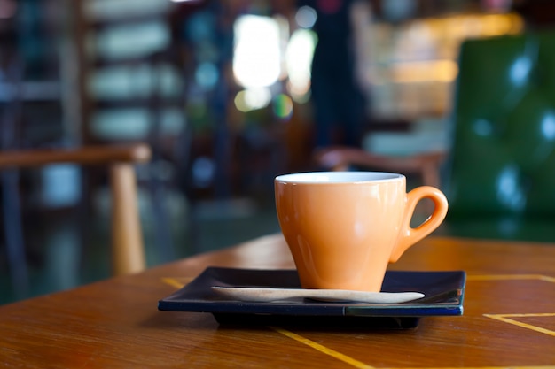 Photo hot coffee cup in coffee shop.