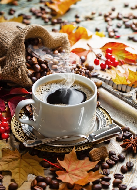 Hot coffee in a cup on an old background