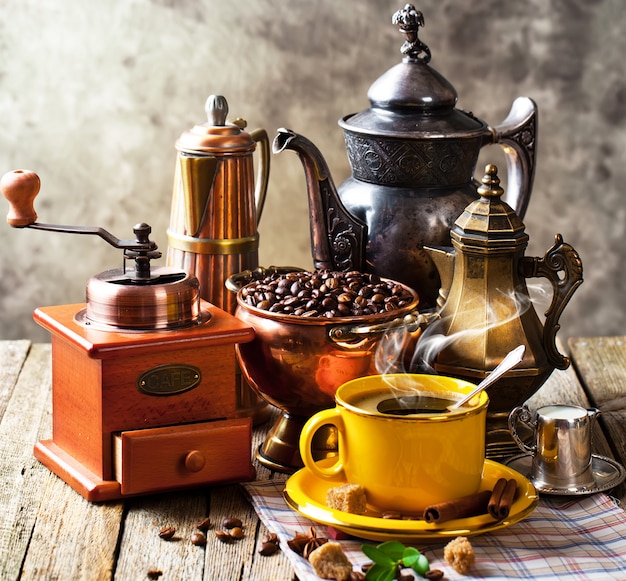 Hot coffee in a cup on an old background