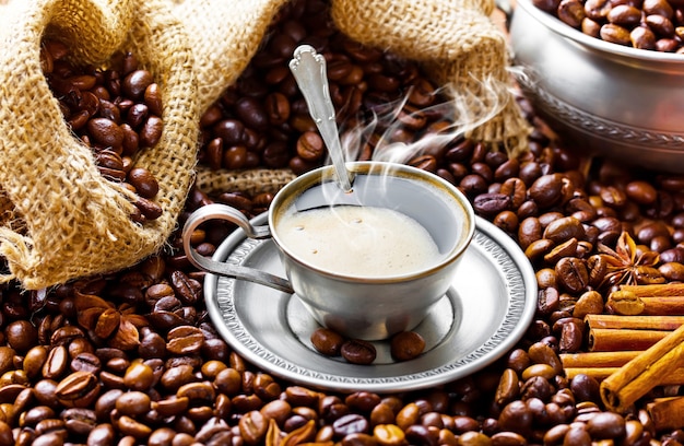 Hot coffee in a cup on an old background