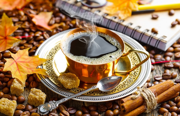 Hot coffee in a cup on an old background