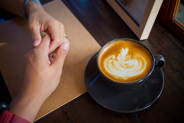 hot coffee cup on table at morning, relax time, latte coffee