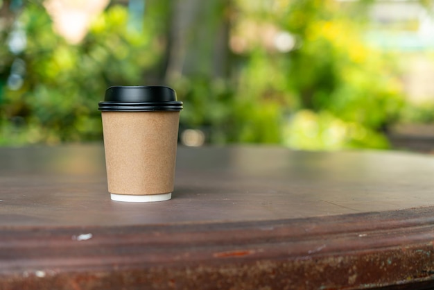 hot coffee cup on wood table with copy space