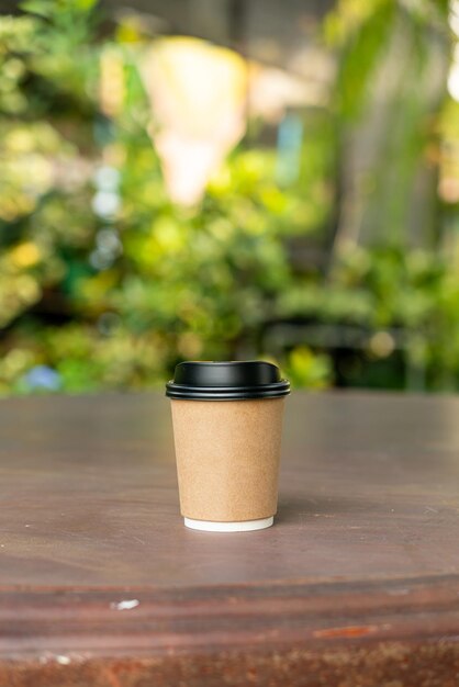 hot coffee cup on wood table with copy space