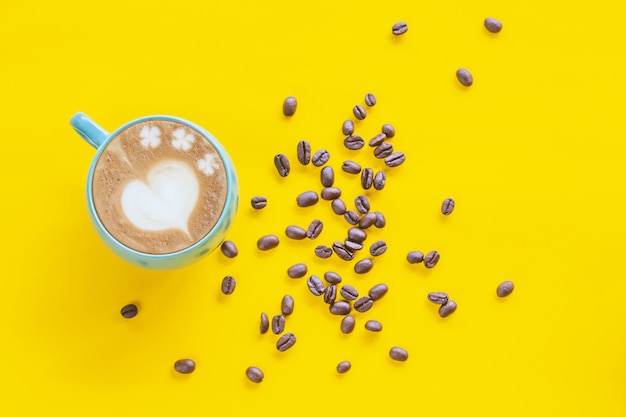 Hot Coffee Latte Art Heart on color background.