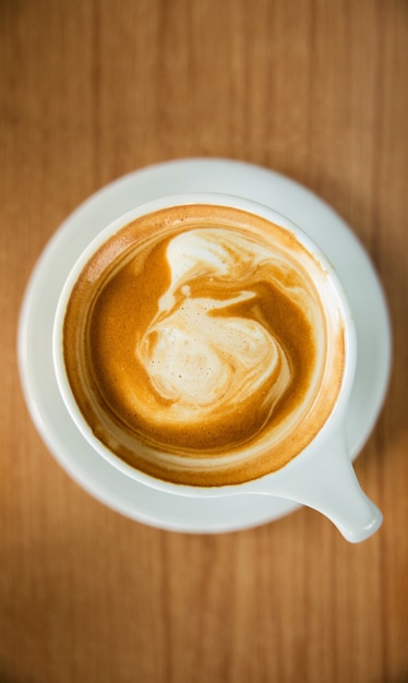 Hot Coffee Latte Cup on Wooden Table