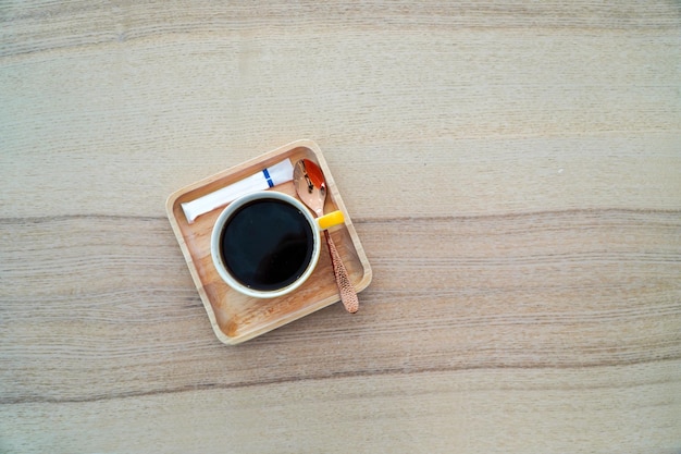 Hot coffee mug on wooden tablecoffee concept