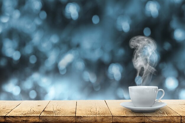 Hot coffee on the table on a winter background