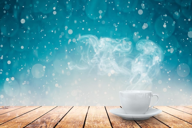 Hot coffee on the table on a winter background