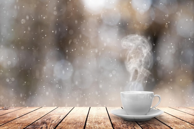 Hot coffee on the table on a winter background