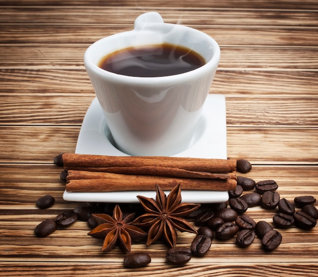 hot coffee in white cup on wooden background