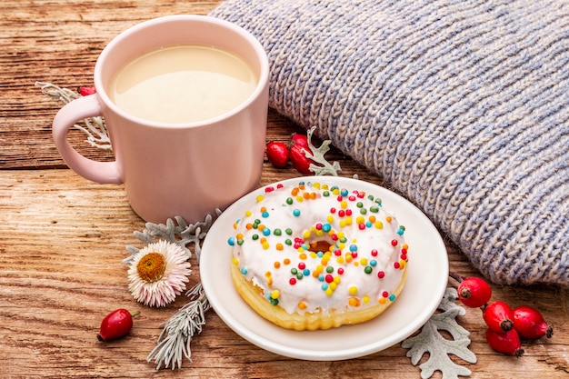 Hot coffee with a donut and decoration