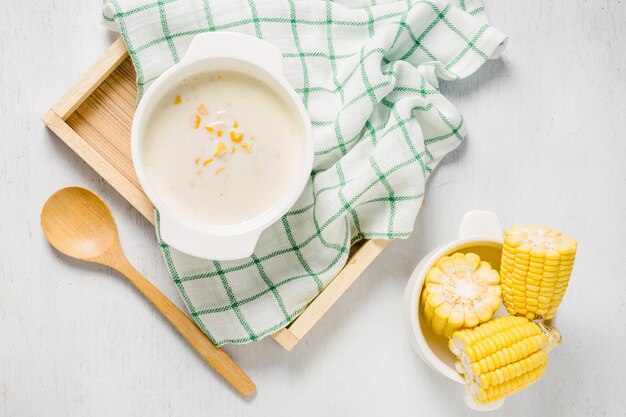 hot corn soup in a white bowl