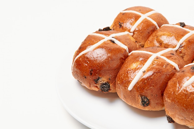 Hot cross bun on white background