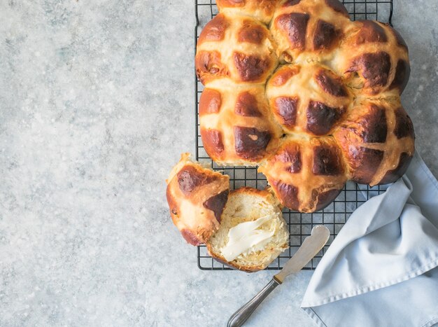 Hot cross buns with butter.  Traditional easter treat