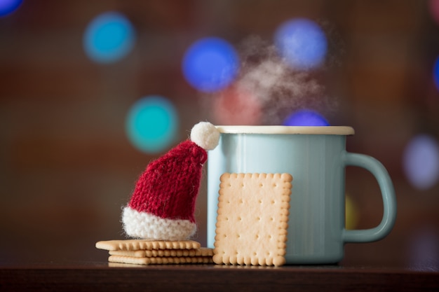 Hot cup of coffee and classic cookie, Santa Claus