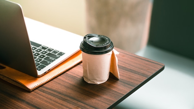 Hot cup of coffee in comfortable cafe.