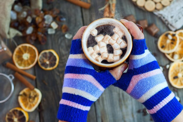 Hot cup of coffee in hands