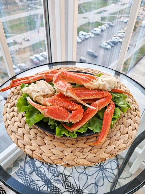 A hot dish of snow crab on a beautiful plate.