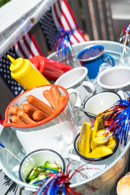 Hot dog bar with corn on the cob for July 4th celebration on the back patio.