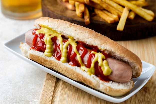 Hot dog with fries and beer