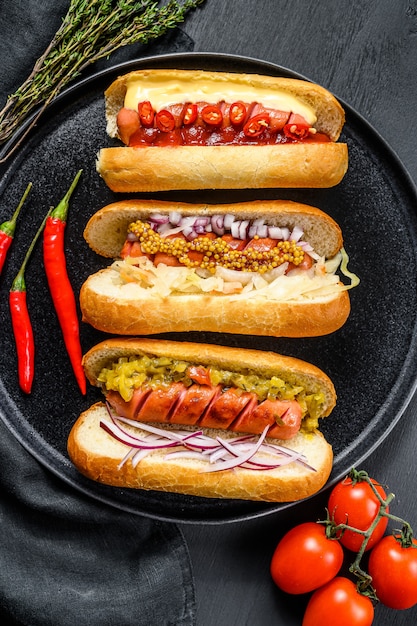 Hot dogs with assorted toppings on a tray