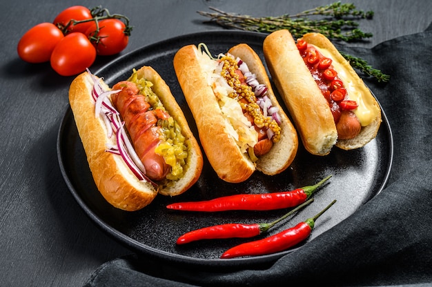 Hot dogs with assorted toppings on a tray