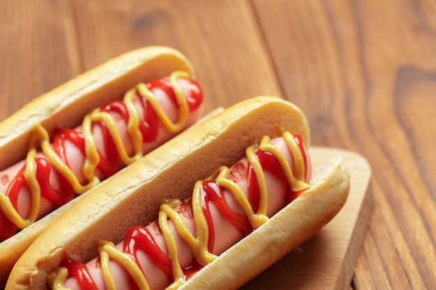 Hot dogs on wooden background