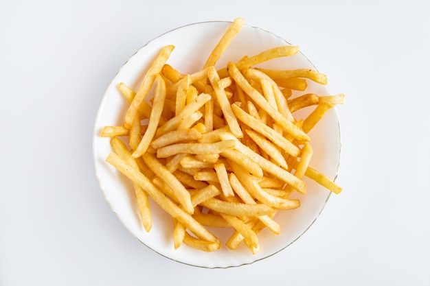 Hot french fries on white background American unhealthy food