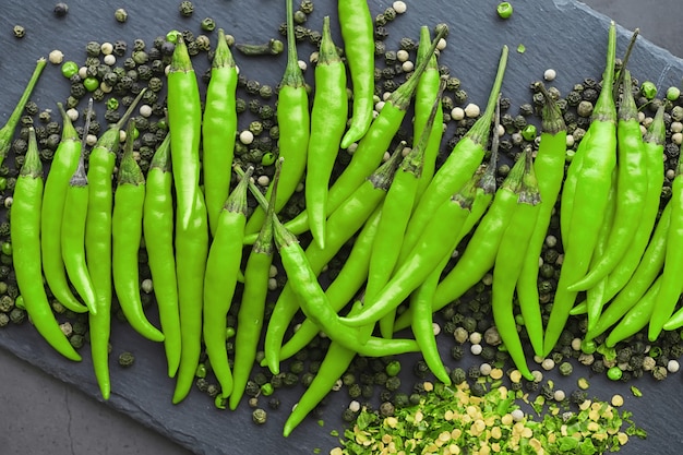 Hot green pepper. Chilean pepper on a black background.