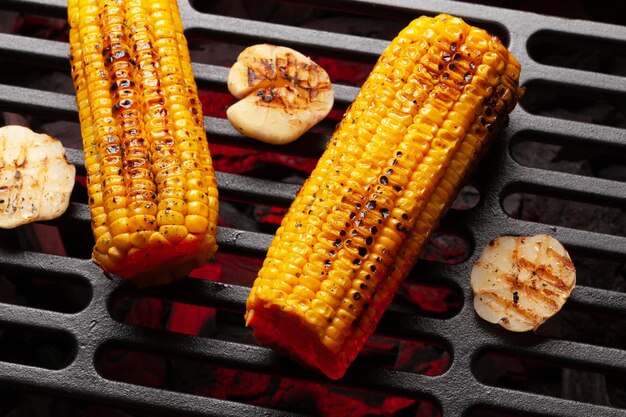 Hot grilled corn on coal grill