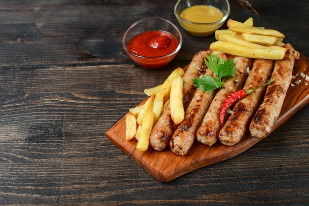 hot grilled sausages, with french fries ketchup mustard