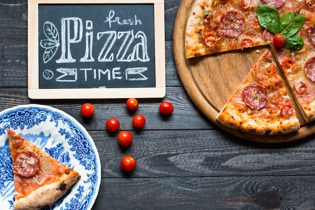 Hot Italian pizza on a rustic wooden table.